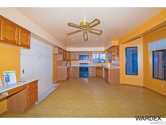 303 South Hano Road Golden Valley, AZ 86413 - Photo 8 of 30 a view of kitchen with furniture and window