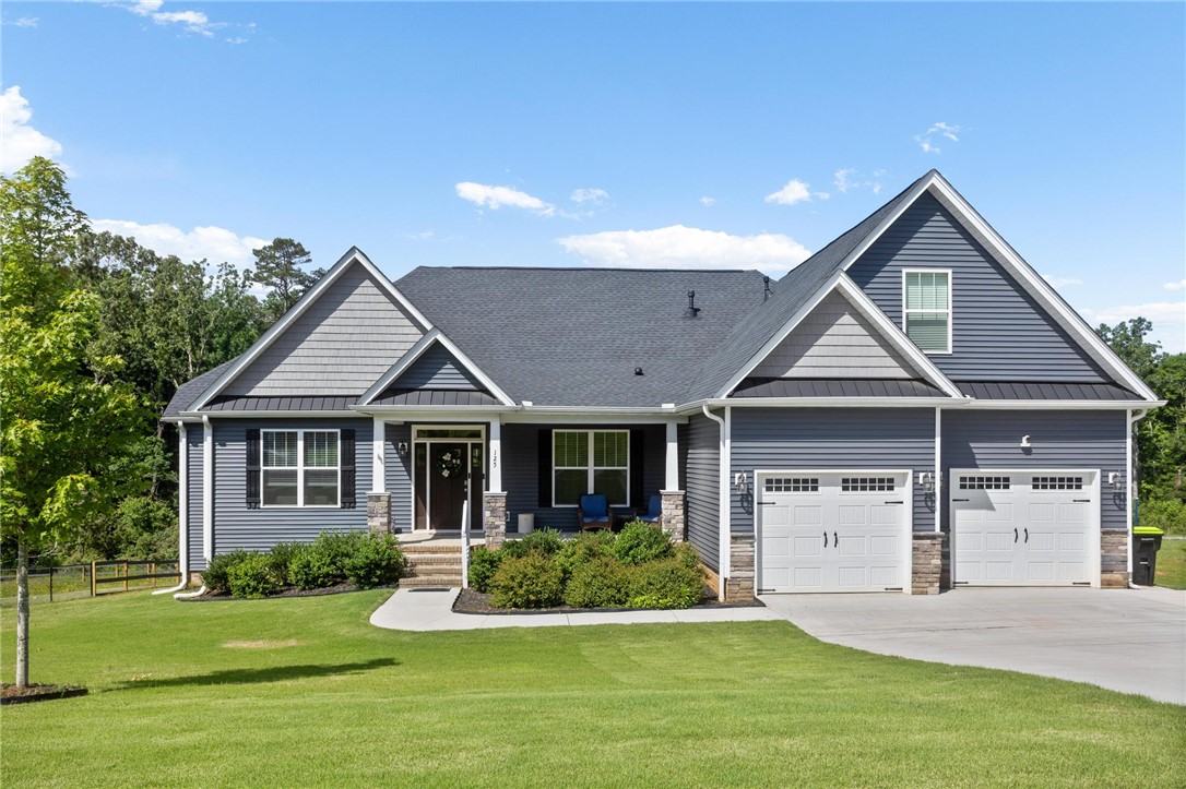 125 Estateside Drive Anderson, SC 29621 - Photo 1 of 37 A classic ranch home showcasing a beautiful facade with clean lines and mature landscaping.