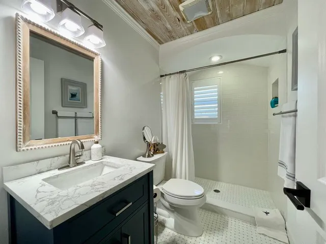 a bedroom with a bed and chair