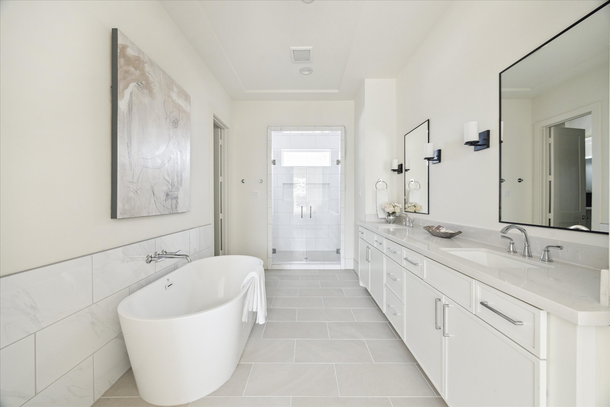 5309 Lambeth Riverside Drive Houston, TX 77091 - Photo 14 of 29 a spacious bathroom with a double vanity sink mirror and bathtub