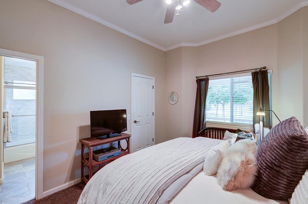 17465 Monreal Road Madera, CA 93636 - Photo 41 of 59 a bedroom with a bed and a television
