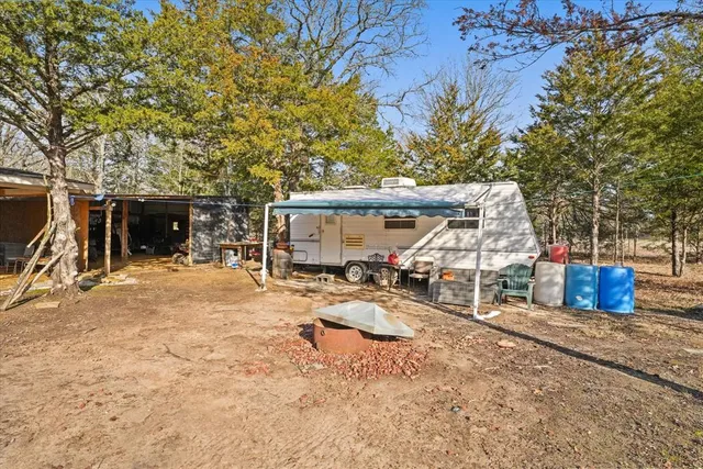 a view of a backyard of the house
