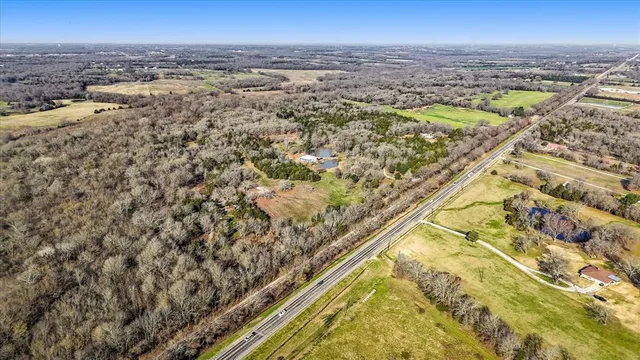an aerial view of residential building and ocean