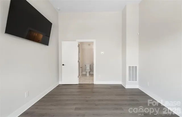 a view of a livingroom with wooden floor