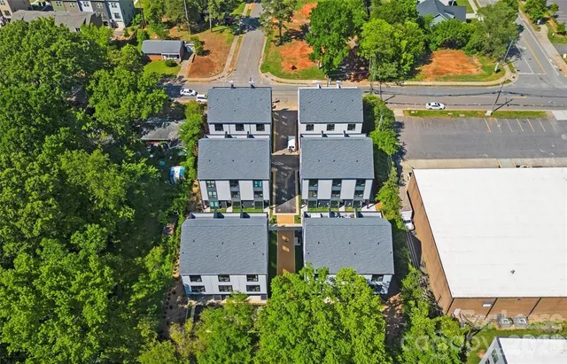 an aerial view of a house with outdoor space