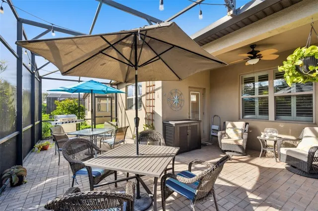 a patio with a patio table and chairs