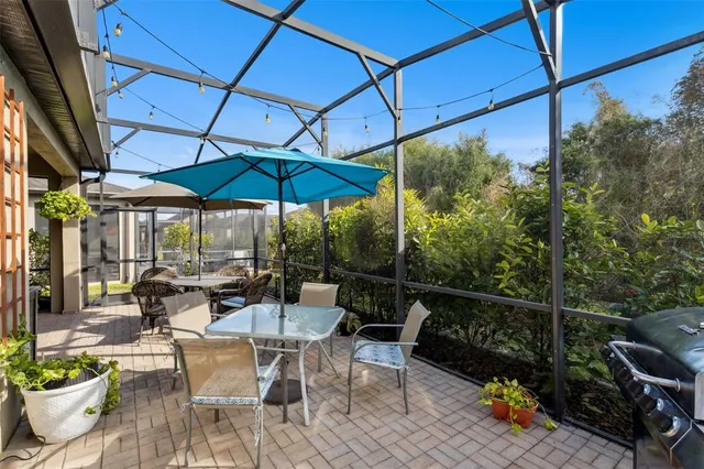 a view of a chairs and table in the patio