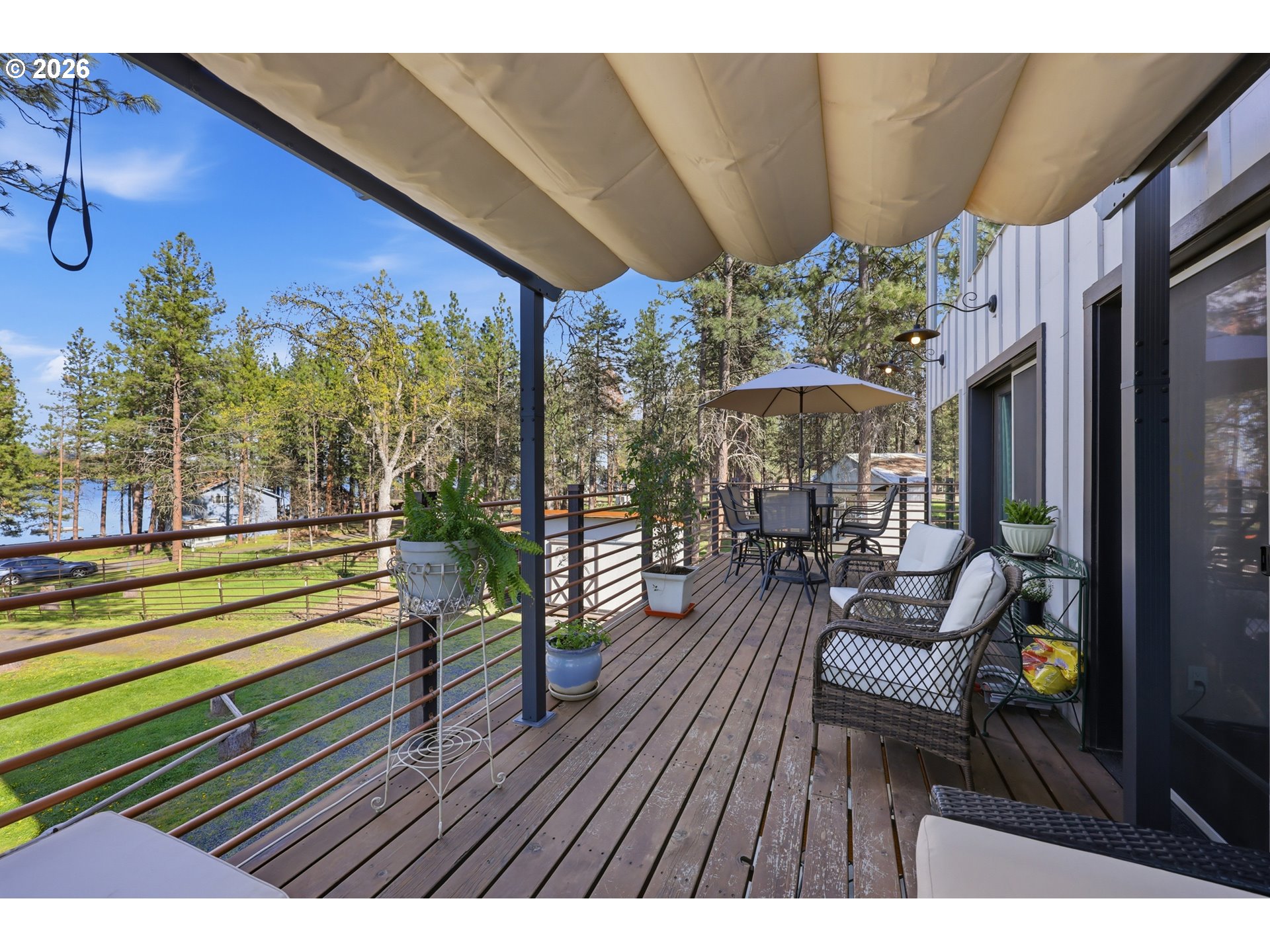 206 South Lakewood Road Tygh Valley, OR 97063 - Photo 32 of 48 a view of a chairs and table in patio with a barbeque