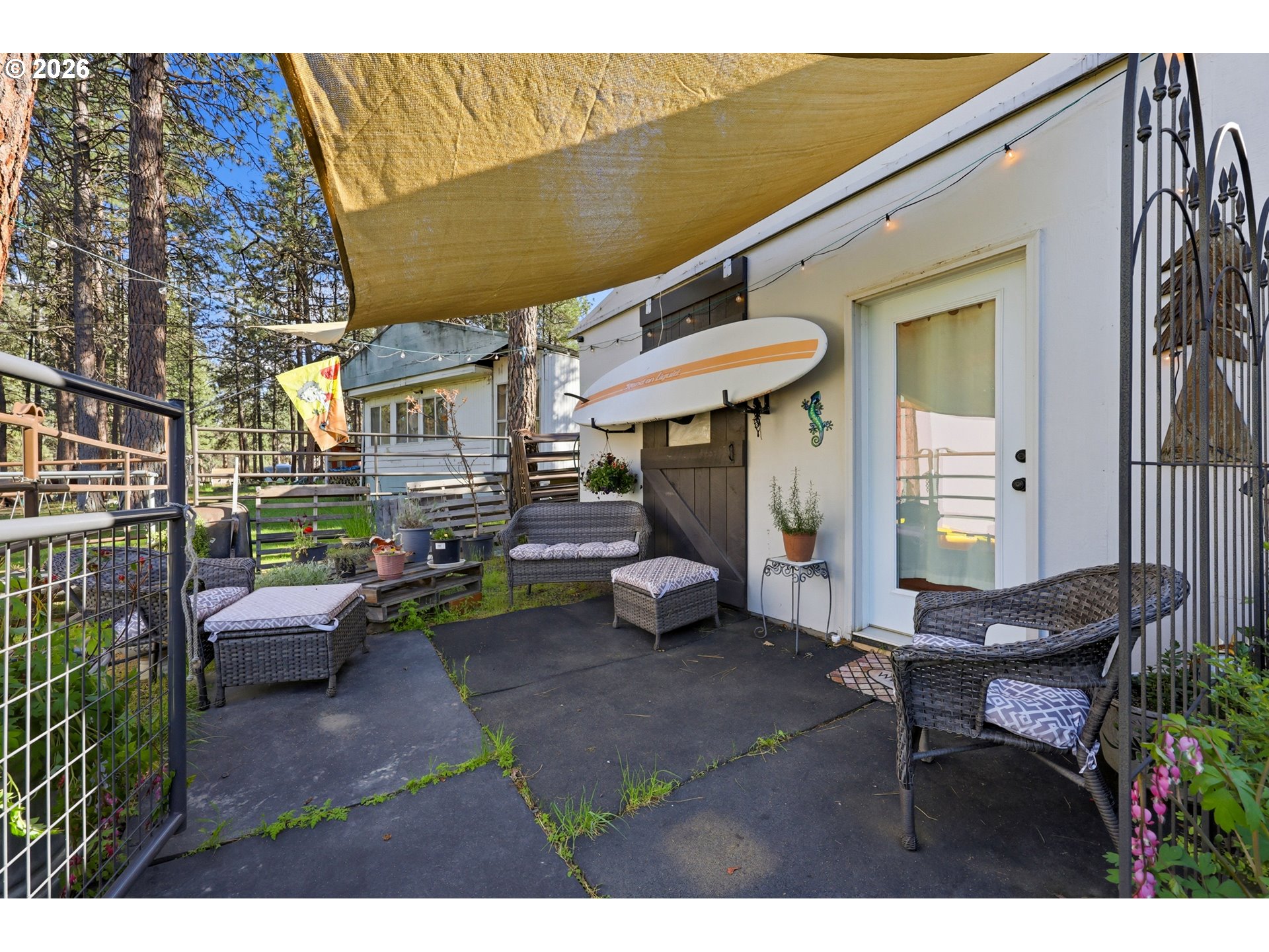 206 South Lakewood Road Tygh Valley, OR 97063 - Photo 38 of 48 a view of a patio with table and chairs under an umbrella
