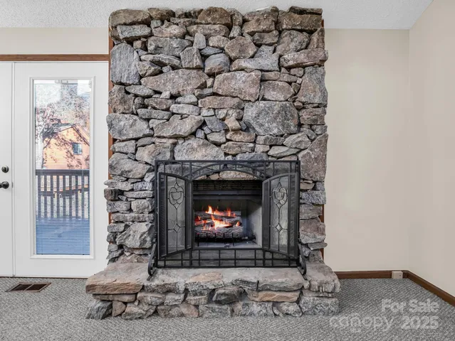 a living room with a fireplace