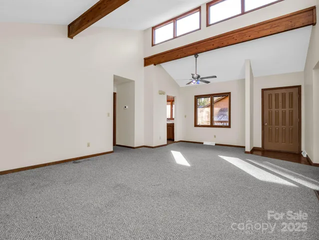 a view of a house with a empty space and a window