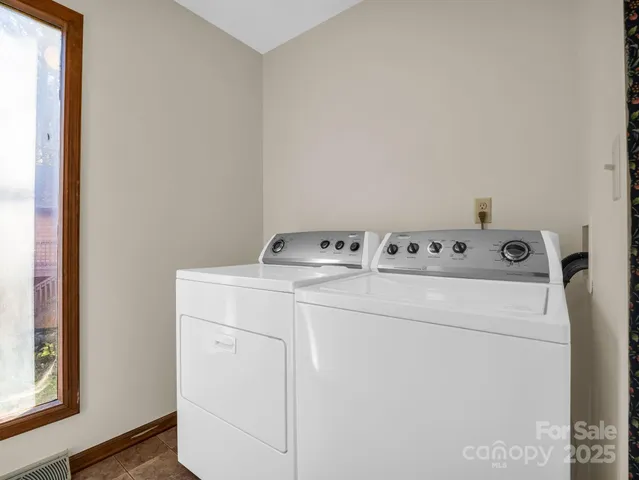 a utility room with dryer and washer