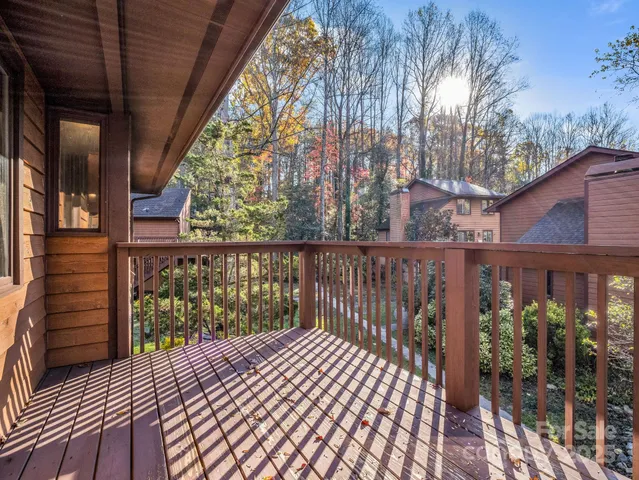 a view of a balcony with wooden floor
