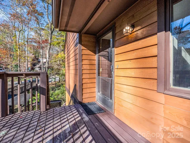 a view of balcony with wooden floor