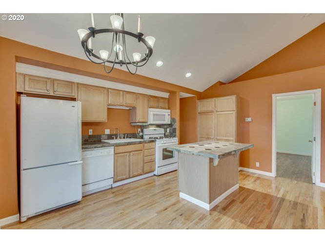 500 Toliver Road Molalla, OR 97038 - Photo 13 of 25 a kitchen with stainless steel appliances granite countertop a stove oven and a refrigerator