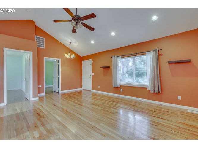 500 Toliver Road Molalla, OR 97038 - Photo 5 of 25 a view of an empty room with window and wooden floor
