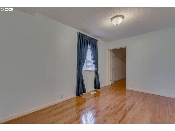 500 Toliver Road Molalla, OR 97038 - Photo 8 of 25 a view of an empty room with wooden floor and closet