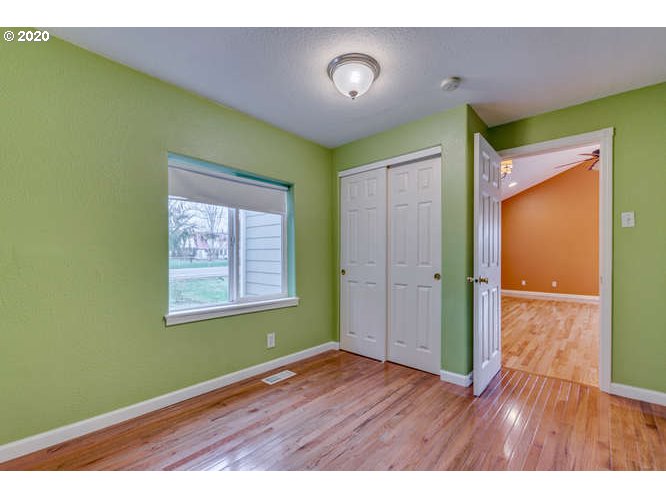 500 Toliver Road Molalla, OR 97038 - Photo 10 of 25 a view of an empty room with wooden floor and a window