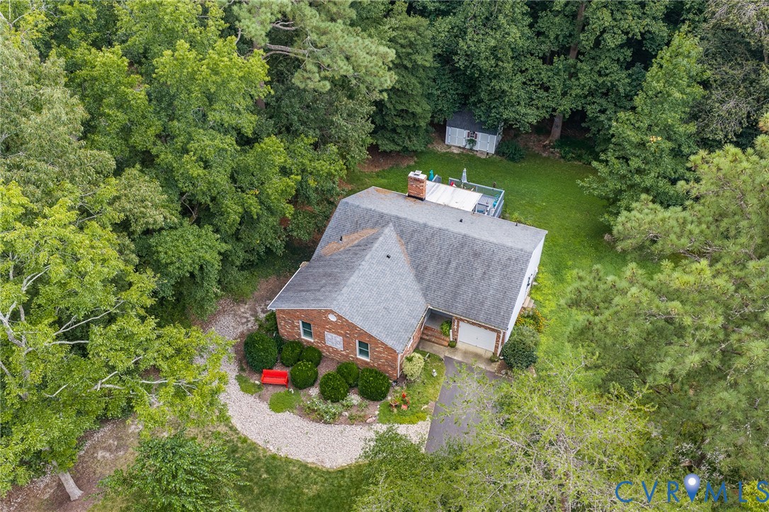 3841 Strawhill Road Richmond, VA 23231 - Photo 46 of 56 Brick exterior with an attached garage, featuring