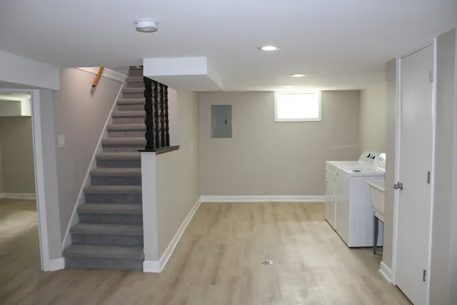 a view of entryway with stairs and wooden floor