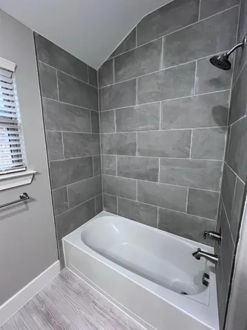 a bathroom with a white bathtub