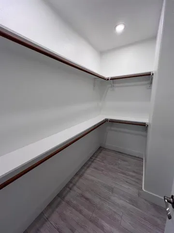 a storage room with wooden floor