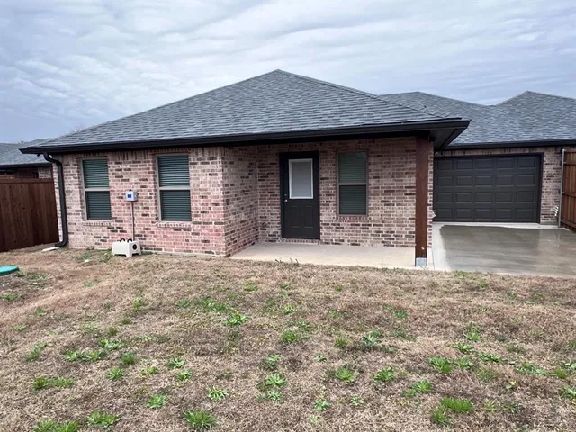 a front view of a house with yard
