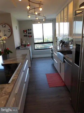 a kitchen with a sink and a window
