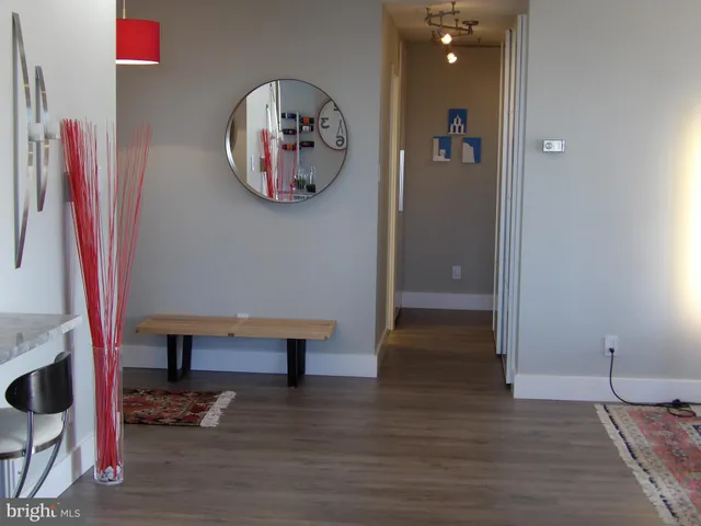 a bathroom with a sink mirror and toilet