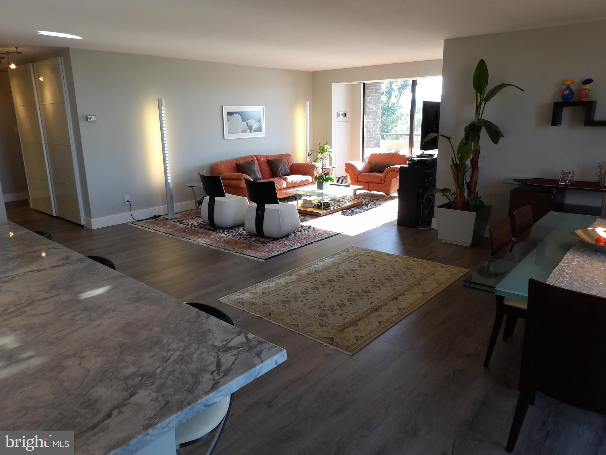 1800 Old Meadow Road, Unit 902 McLean, VA 22102 - Photo 30 of 67 a living room with furniture and a window