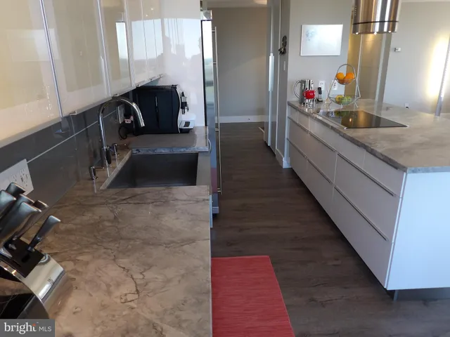 a bathroom with a toilet a sink and shower