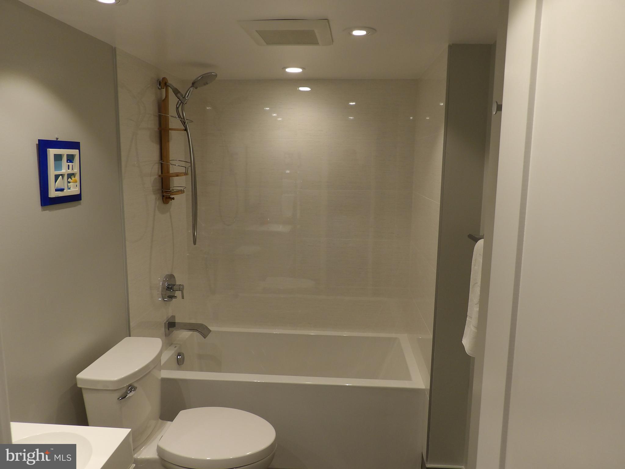 1800 Old Meadow Road, Unit 902 McLean, VA 22102 - Photo 33 of 67 a bathroom with a shower a toilet and a sink