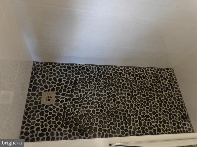 a bedroom with a bed and a desk