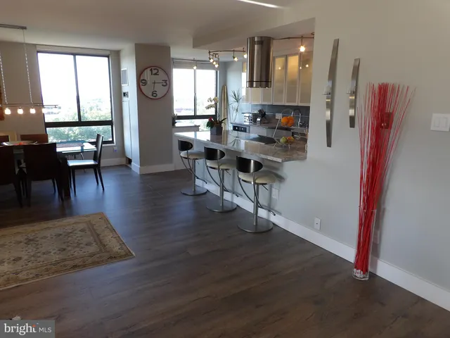 a living room with fireplace furniture and a window