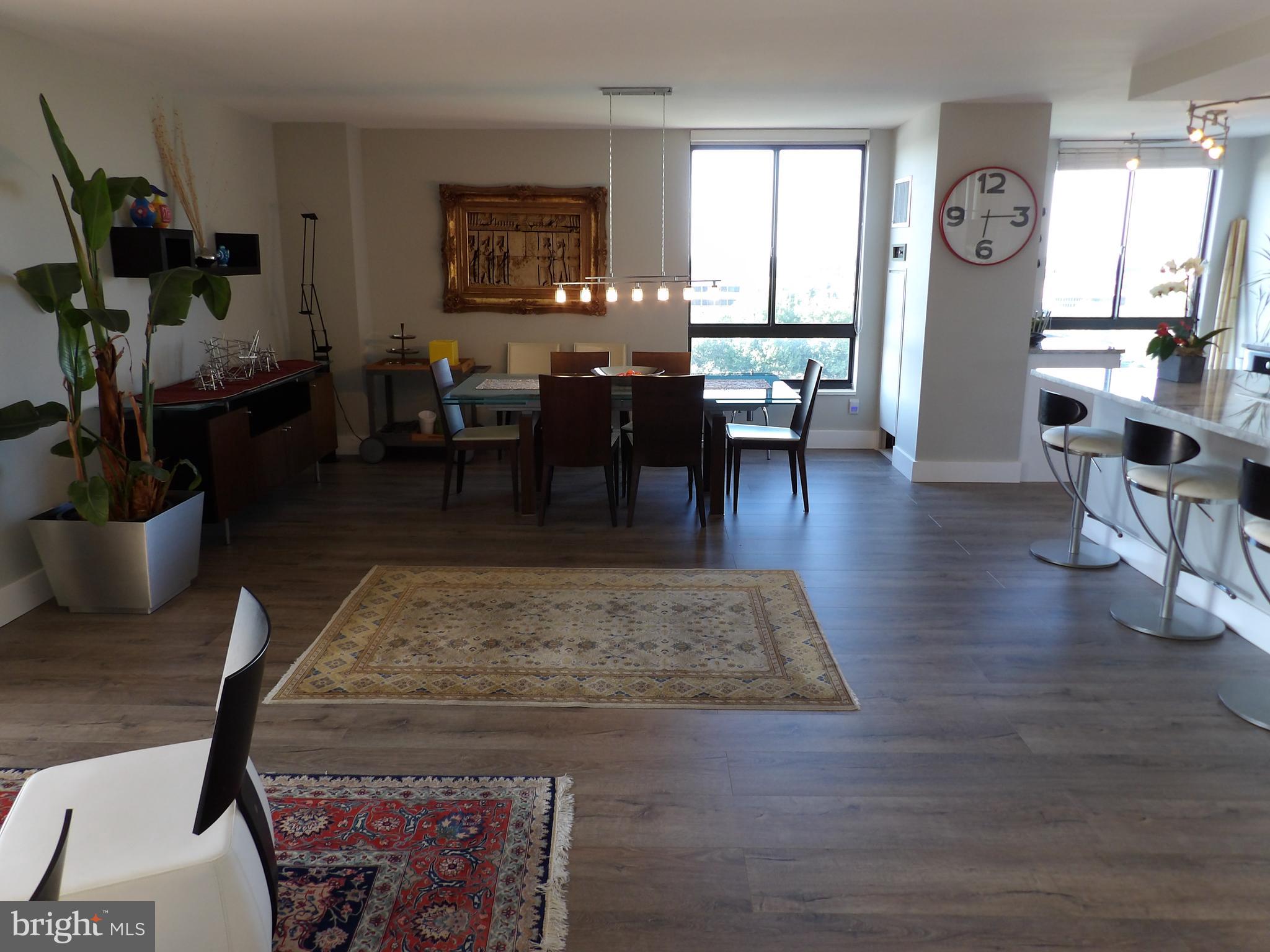1800 Old Meadow Road, Unit 902 McLean, VA 22102 - Photo 6 of 67 a living room with fireplace furniture and a window