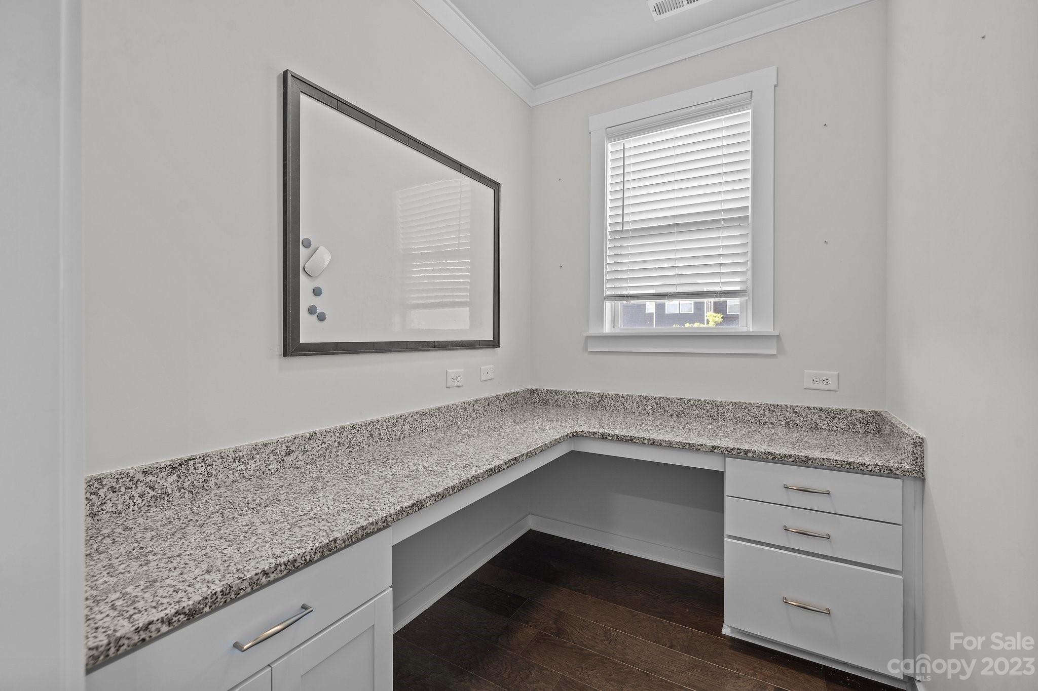 1256 Therns Ferry Drive Fort Mill, SC 29708 - Photo 13 of 47 a hallway with granite countertop cabinets and window