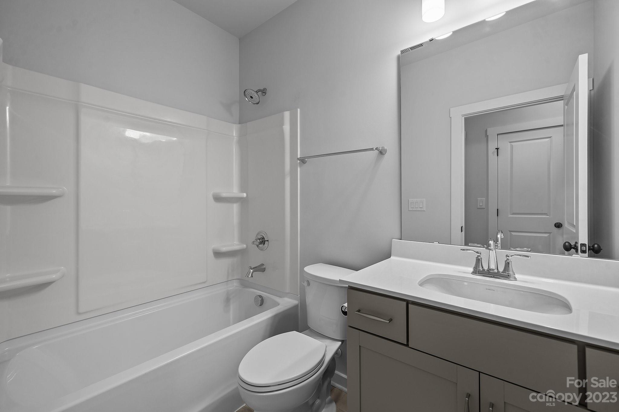 1256 Therns Ferry Drive Fort Mill, SC 29708 - Photo 18 of 47 a bathroom with a sink a toilet and shower