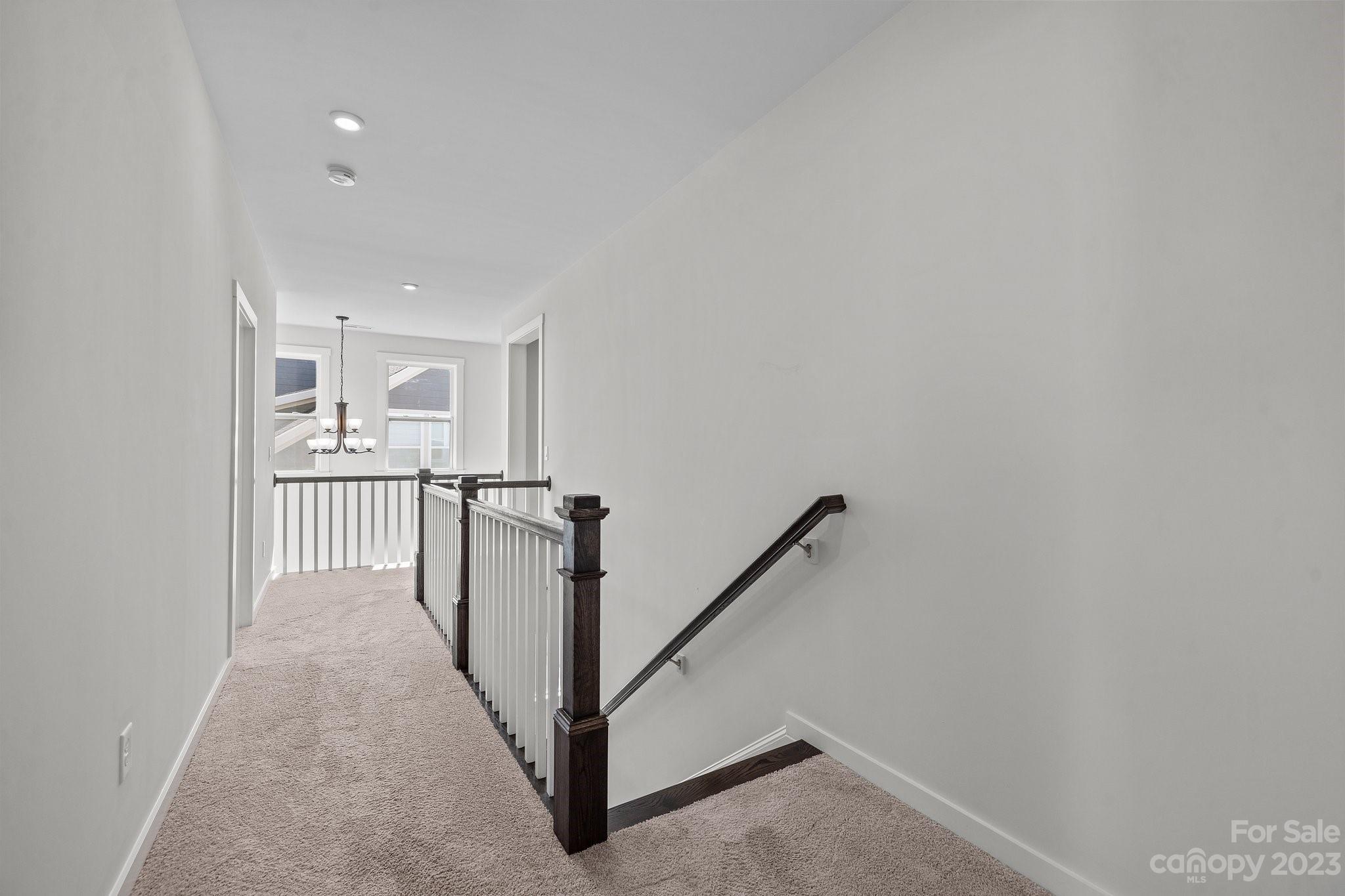 1256 Therns Ferry Drive Fort Mill, SC 29708 - Photo 32 of 47 a view of a hallway with staircase