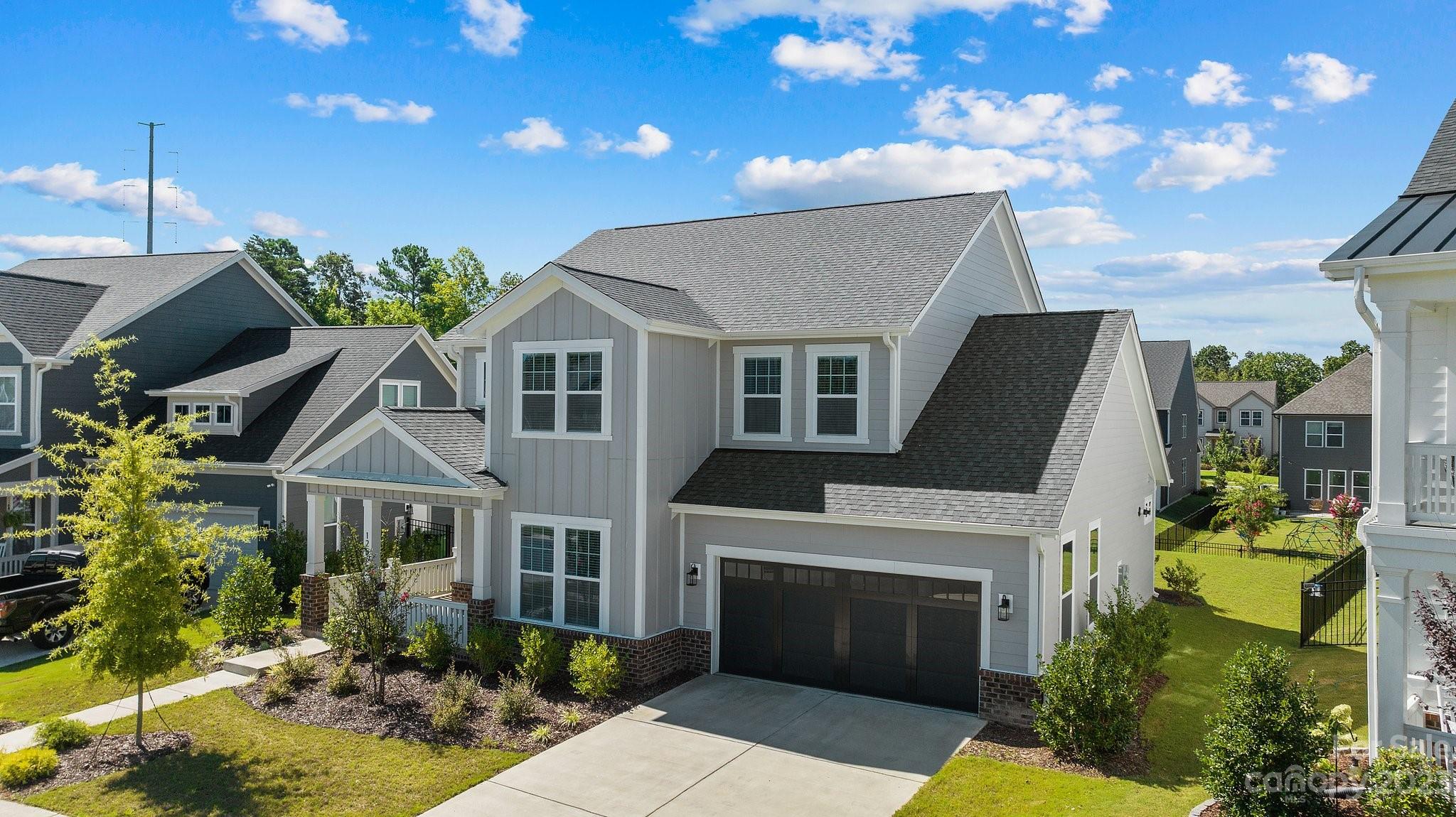 1256 Therns Ferry Drive Fort Mill, SC 29708 - Photo 40 of 47 a front view of a house with a garden