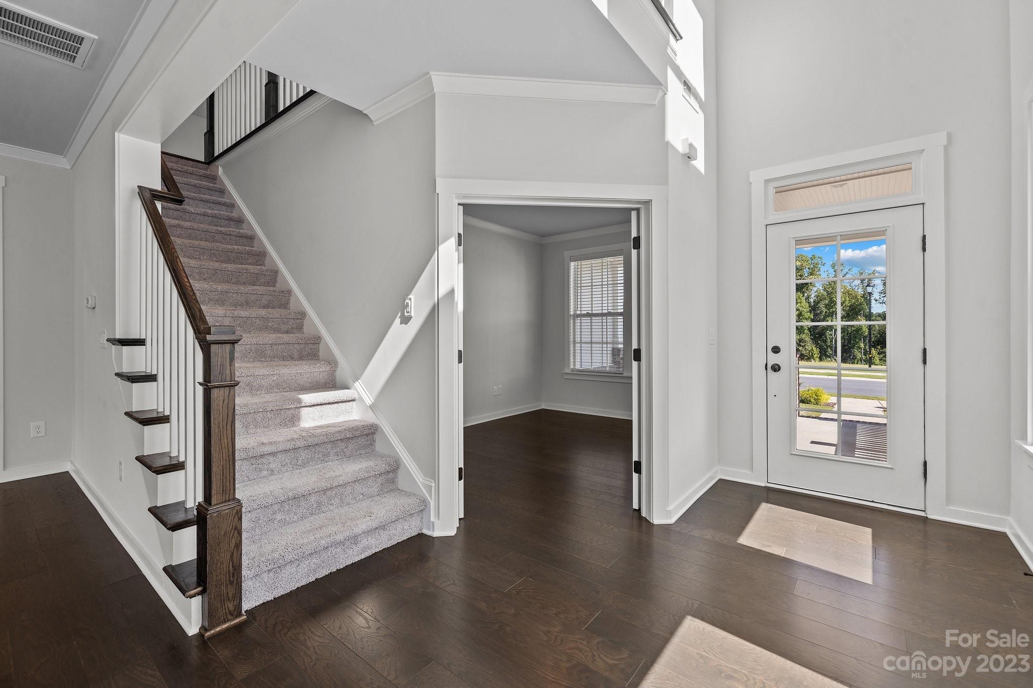 1256 Therns Ferry Drive Fort Mill, SC 29708 - Photo 4 of 47 a view of entryway with wooden floor and stairs