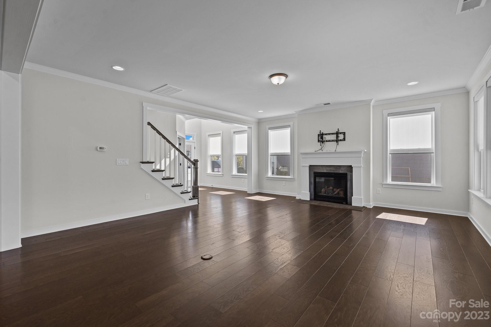 1256 Therns Ferry Drive Fort Mill, SC 29708 - Photo 8 of 47 a view of empty room with wooden floor and fireplace