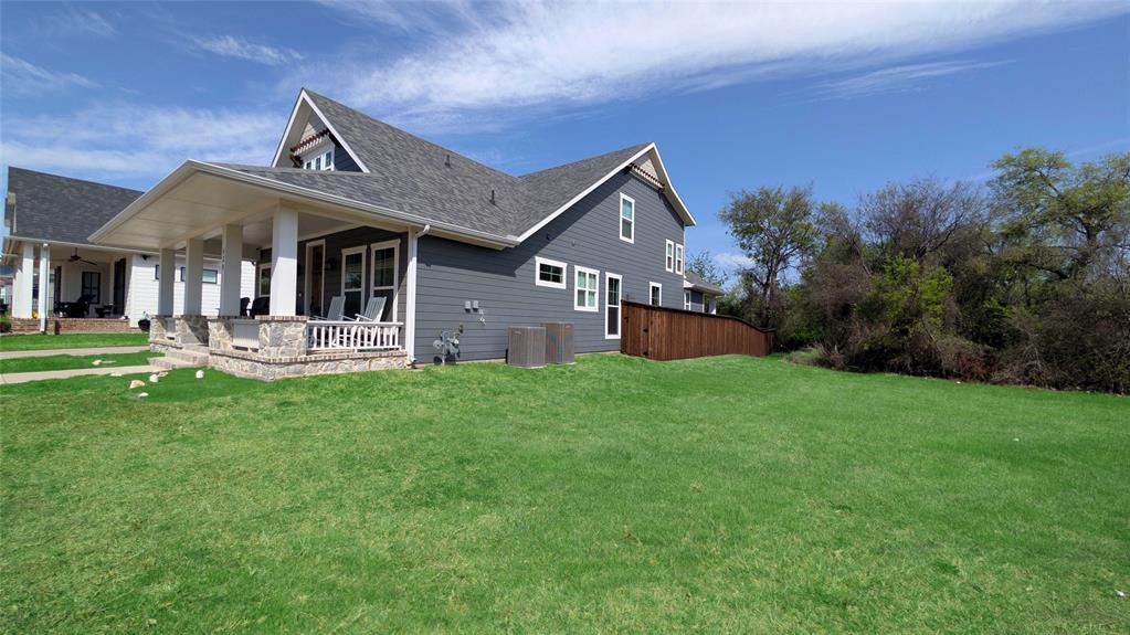 429 Skye Lane Midlothian, TX 76065 - Photo 27 of 29 a front view of a house with a garden and yard