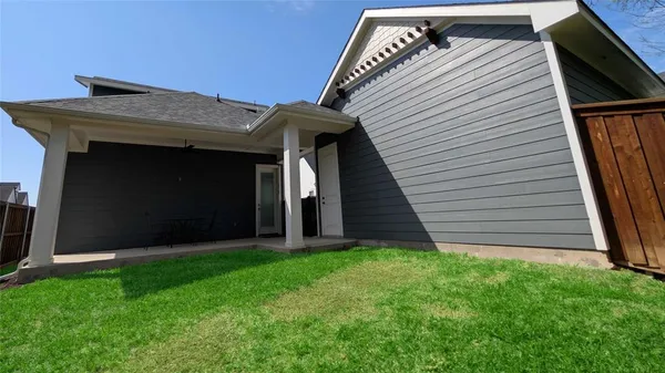 a close up of a table with a vase of flowers