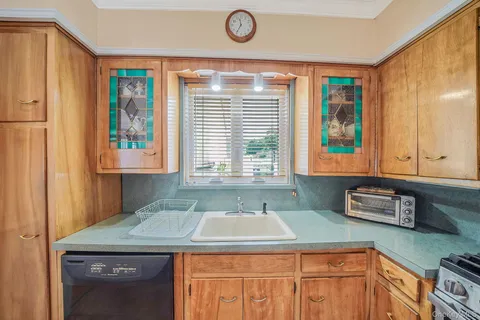 a bathroom with a sink and a window
