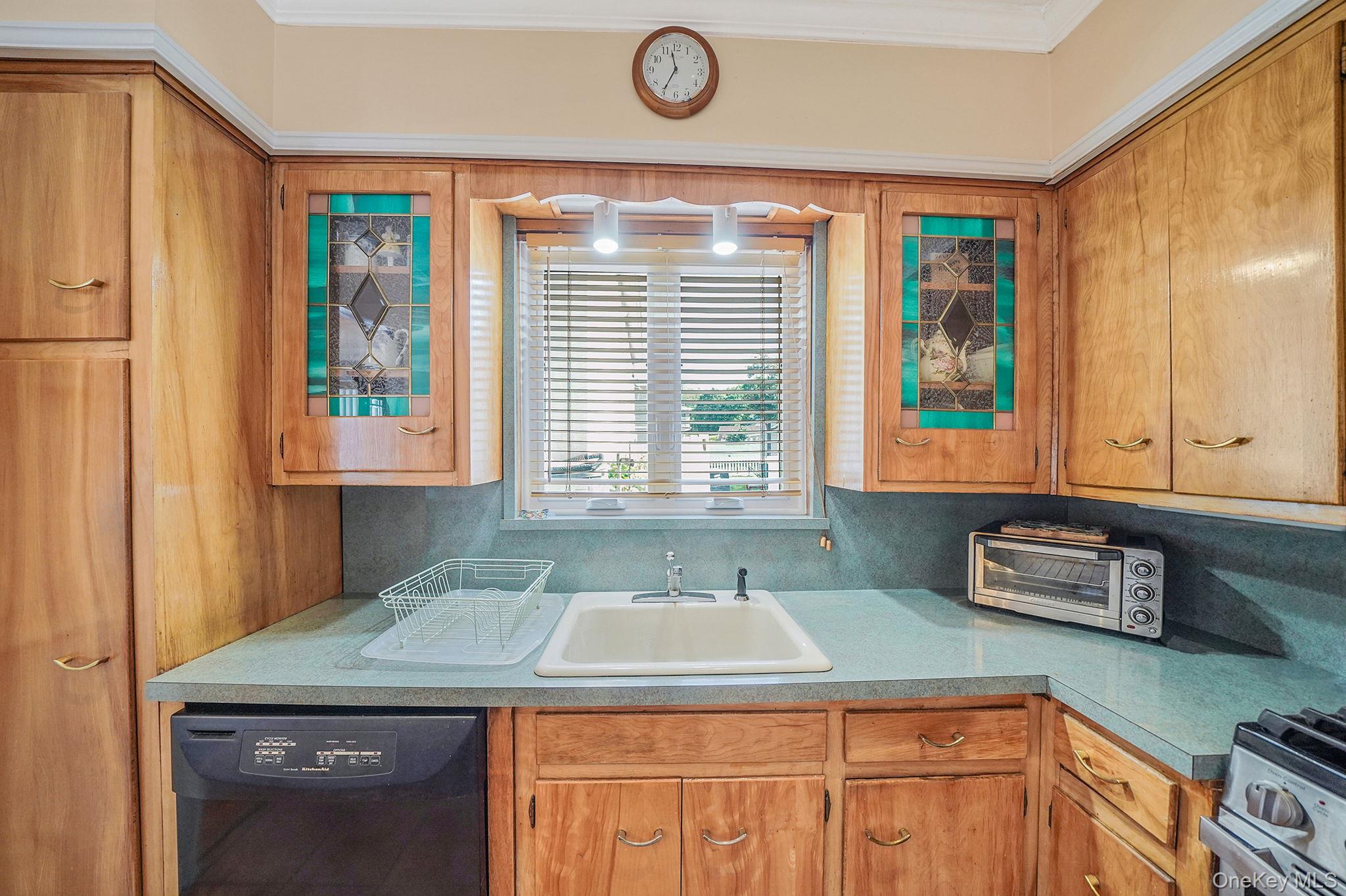 256-12 87th Road Floral Park, NY 11001 - Photo 13 of 33 a bathroom with a sink and a window