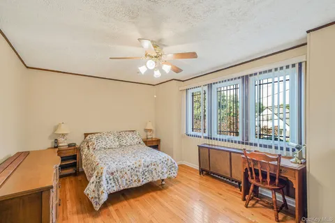 a bedroom with a bed and a table in it