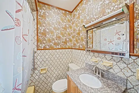 a view of empty room with wooden ceiling