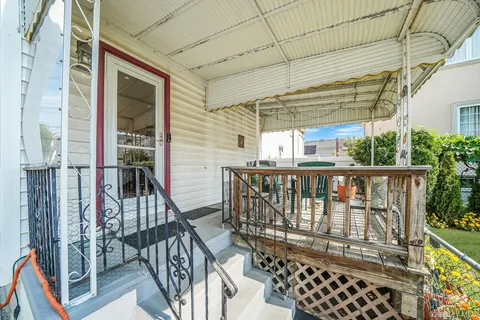 a view of a house with a yard and garden
