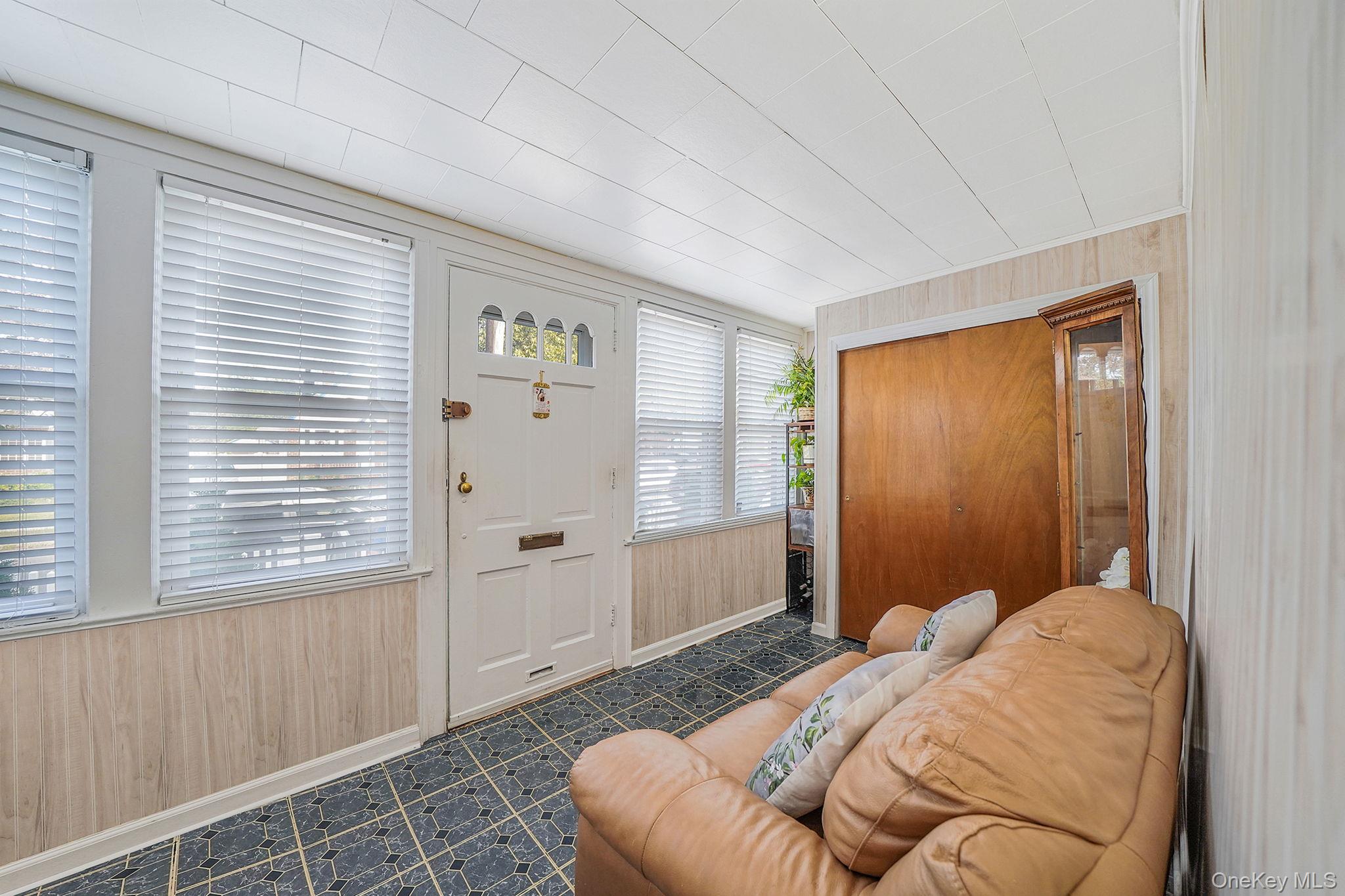 256-12 87th Road Floral Park, NY 11001 - Photo 3 of 33 a bedroom with a bed and a window