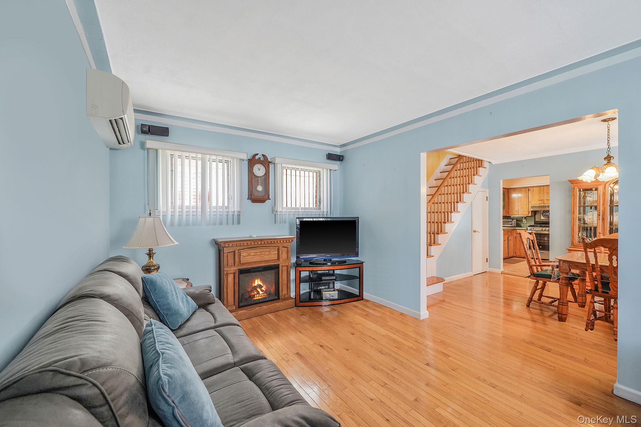 256-12 87th Road Floral Park, NY 11001 - Photo 4 of 33 a living room with furniture and a flat screen tv